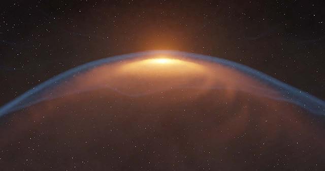 恒星ジェットが作るバブルの衝撃波にゆがめられた原始惑星系円盤