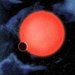 GJ 1214bとその主星（赤）の想像図