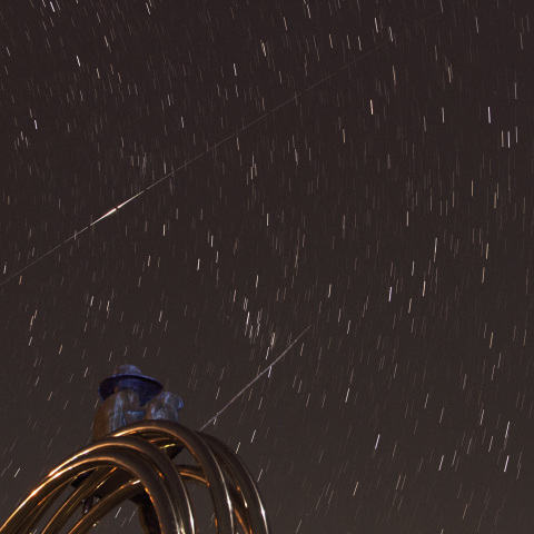 釣り少年とイリジウムフレア