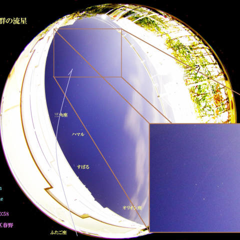 団地の空の薄雲越しのふたご座流星群の流れ星